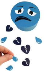 Krmík smutný smajlík s tubusem